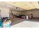 Spacious garage providing ample parking and storage with a high ceiling and lighting at 6404 S Lazy Ln, Gold Canyon, AZ 85118