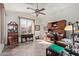 Home office features large window, tile floor, and wood furnishings at 6404 S Lazy Ln, Gold Canyon, AZ 85118