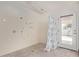 Accessible walk-in shower with safety bars and non-slip floor, and glass door to the exterior at 6404 S Lazy Ln, Gold Canyon, AZ 85118