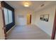 Bright bedroom featuring a blue accent wall, tile floors, and stylish modern lighting at 6411 S River Dr # 53, Tempe, AZ 85283