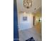 Bright foyer with modern chandelier and desert-themed artwork at 6411 S River Dr # 53, Tempe, AZ 85283