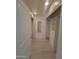 Well-lit hallway with access to closets and other rooms at 6411 S River Dr # 53, Tempe, AZ 85283