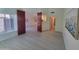 Bright living space with art and view of another room through double doors at 6411 S River Dr # 53, Tempe, AZ 85283