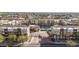 Stunning aerial view of a gated condominium community with a pool and manicured landscaping at 6605 N 93Rd Ave # 1022, Glendale, AZ 85305