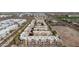 Scenic aerial shot of a vibrant neighborhood, showcasing townhomes with modern architecture and lush greenery at 6605 N 93Rd Ave # 1022, Glendale, AZ 85305