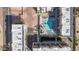 Aerial shot of the condominium community, featuring pool, parking, and adjacent neighborhood at 6605 N 93Rd Ave # 1022, Glendale, AZ 85305