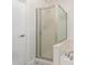 Bathroom with a tub, shower with glass doors, patterned tile floors, and white walls at 6605 N 93Rd Ave # 1022, Glendale, AZ 85305