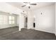 Bedroom with mirrored closet, neutral carpet, ceiling fan, and bathroom at 6605 N 93Rd Ave # 1022, Glendale, AZ 85305
