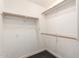 Walk-in closet with white walls, carpeted floor, and multiple clothing rods at 6605 N 93Rd Ave # 1022, Glendale, AZ 85305