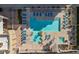 Overhead view of the community pool, featuring lounge chairs, umbrellas, and lush landscaping at 6605 N 93Rd Ave # 1022, Glendale, AZ 85305