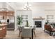 Cozy dining area featuring a fireplace with marble tile, a view to the kitchen, and modern decor at 6605 N 93Rd Ave # 1022, Glendale, AZ 85305