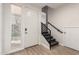 Bright entryway with staircase, white door, luxury vinyl plank flooring, and abundant natural light at 6605 N 93Rd Ave # 1022, Glendale, AZ 85305