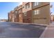 Attractive townhome exteriors with attached garages, modern design, and well-maintained landscaping at 6605 N 93Rd Ave # 1022, Glendale, AZ 85305