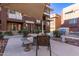 Outdoor seating, BBQ, and common areas are features of this townhome exterior at 6605 N 93Rd Ave # 1022, Glendale, AZ 85305