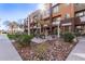 A communal BBQ area features outdoor seating, mature landscaping, and a shade structure at 6605 N 93Rd Ave # 1022, Glendale, AZ 85305