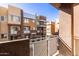 View from balcony of multi-story townhomes with stucco and metal awning accents at 6605 N 93Rd Ave # 1022, Glendale, AZ 85305