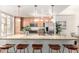 Well-lit kitchen featuring a large island with bar seating, stainless steel appliances, and light wood cabinets at 6605 N 93Rd Ave # 1022, Glendale, AZ 85305