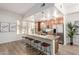 Spacious kitchen featuring a large island with bar seating, stainless steel appliances, and light wood cabinets at 6605 N 93Rd Ave # 1022, Glendale, AZ 85305
