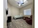 Cozy bedroom featuring a ceiling fan and natural light at 757 W Magma Rd, San Tan Valley, AZ 85143