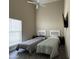 Bedroom with wood-look tile floors and two twin beds at 757 W Magma Rd, San Tan Valley, AZ 85143