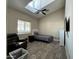 Bedroom with skylight, fan, and wood-look tile floors at 757 W Magma Rd, San Tan Valley, AZ 85143