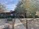 Charming single-story home with desert landscaping, mature trees, and a cozy walkway to the front door at 757 W Magma Rd, San Tan Valley, AZ 85143