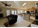 Living room featuring an open floor plan with a kitchen, dining area, fireplace, and outdoor views at 757 W Magma Rd, San Tan Valley, AZ 85143