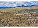 Wide aerial view showcasing property with demarcated boundary, surrounding desert landscape, and distant mountain range at 86Xx E Stagecoach Pass # 4, Carefree, AZ 85377