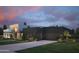 Sleek modern architecture with a dark color scheme, complemented by a well-maintained green lawn at 86Xx E Stagecoach Pass # 4, Carefree, AZ 85377
