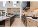 Modern kitchen with stainless steel appliances, a gas range, and natural wood cabinetry at 86Xx E Stagecoach Pass # 4, Carefree, AZ 85377
