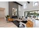 Bright and airy living room with a fireplace, high ceilings, and large sliding glass doors at 86Xx E Stagecoach Pass # 4, Carefree, AZ 85377