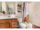 Bright bathroom features a tub with a shower and modern wood vanity at 9183 W Foothill Dr, Peoria, AZ 85383
