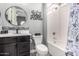 Stylish bathroom features a vanity with a black sink and a bathtub with shower at 9183 W Foothill Dr, Peoria, AZ 85383
