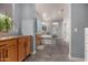 Long bathroom area with a large tub, glass shower, and window overlooking the outside scenery at 9183 W Foothill Dr, Peoria, AZ 85383