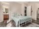 A light-filled bedroom featuring an connected bathroom, offering style and comfort at 9183 W Foothill Dr, Peoria, AZ 85383