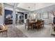 Open-concept dining area showcasing stylish furnishings, adjacent living spaces, and abundant natural light at 9183 W Foothill Dr, Peoria, AZ 85383