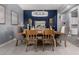 Elegant dining room featuring stylish decor, a wooden table, comfortable seating, and an attractive light fixture at 9183 W Foothill Dr, Peoria, AZ 85383