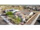 Aerial view of a home with a tile roof, solar panels, and a well-maintained yard in a quiet neighborhood at 9183 W Foothill Dr, Peoria, AZ 85383