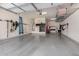 Spacious two-car garage with storage racks and organized tools at 9183 W Foothill Dr, Peoria, AZ 85383