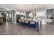 Spacious kitchen boasts a large island with seating, ample cabinet space, and sleek appliances at 9183 W Foothill Dr, Peoria, AZ 85383