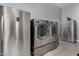 Laundry room features a stainless steel washer and dryer and plenty of space at 9183 W Foothill Dr, Peoria, AZ 85383