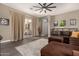 Open-concept living room features hardwood floors and sliding doors to outdoor patio at 9183 W Foothill Dr, Peoria, AZ 85383