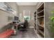 Modern home office with gray walls, built-in shelving, and plenty of natural light at 9183 W Foothill Dr, Peoria, AZ 85383