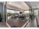 Beautiful outdoor living space featuring an open-air patio with dining area and comfortable lounge seating, perfect for entertaining at 9183 W Foothill Dr, Peoria, AZ 85383