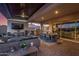 Outdoor patio features a full kitchen, seating area, and TV at 9183 W Foothill Dr, Peoria, AZ 85383