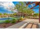 Well-maintained pickleball court surrounded by lush landscaping, offering a great recreational amenity for residents at 9183 W Foothill Dr, Peoria, AZ 85383