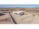 Aerial view of a home showcasing its backyard, privacy wall, and outdoor living potential at 935 Calle Azul --, Wickenburg, AZ 85390