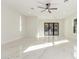 Spacious living room with marble flooring and large glass doors leading outside at 9357 W Canyon Verde Dr, Casa Grande, AZ 85194