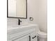 Modern powder room with sleek vanity, black hardware, and elegant finishes at 9357 W Canyon Verde Dr, Casa Grande, AZ 85194