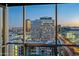 A spectacular city view from the interior featuring tall buildings and a beautiful sunset at 1 E Lexington Ave # 1211, Phoenix, AZ 85012